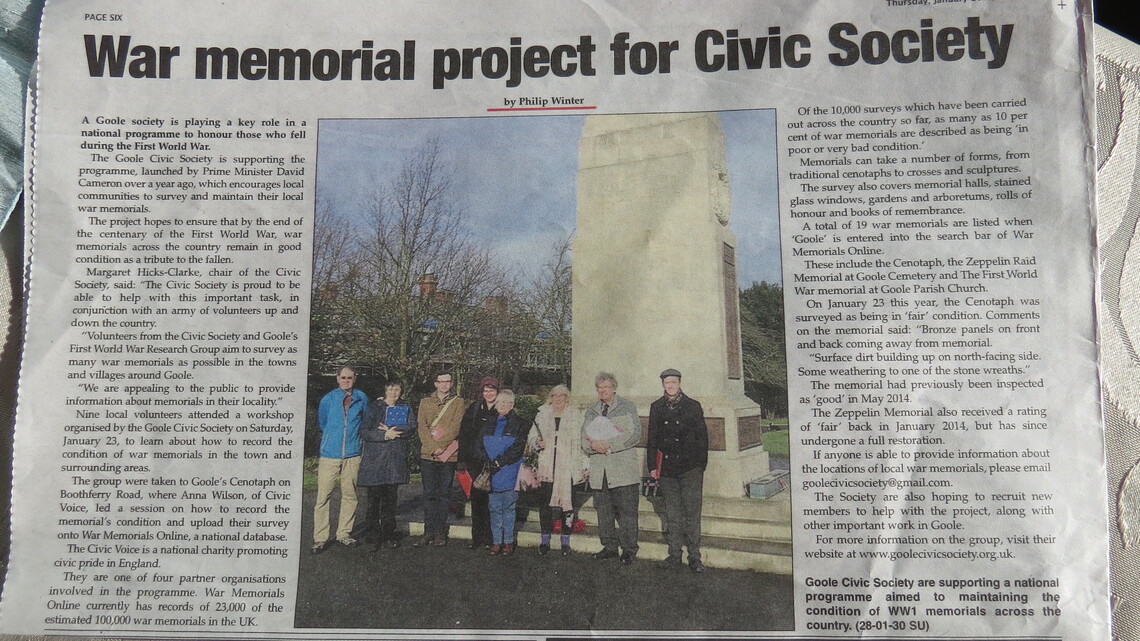 Goole volunteers survey the town's cenotaph as part of a Civic Voice training workshop