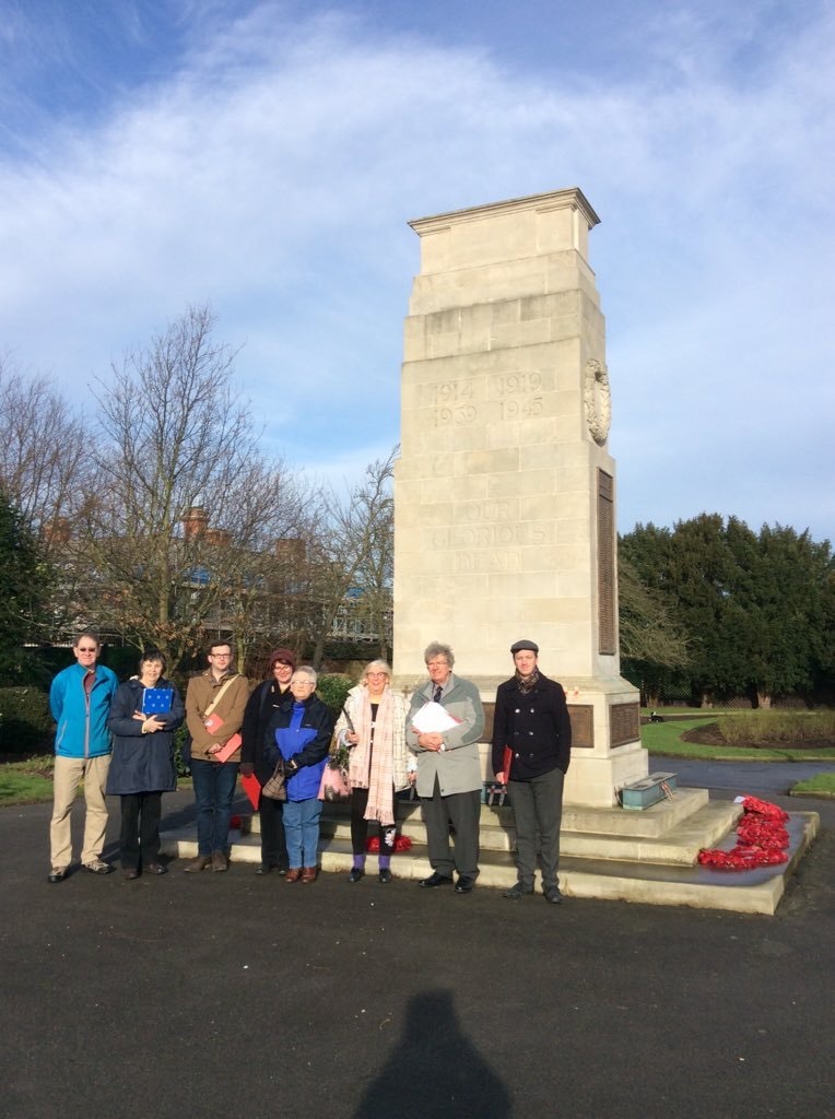 Goole volunteers survey the town's cenotaph as part of a Civic Voice training workshop